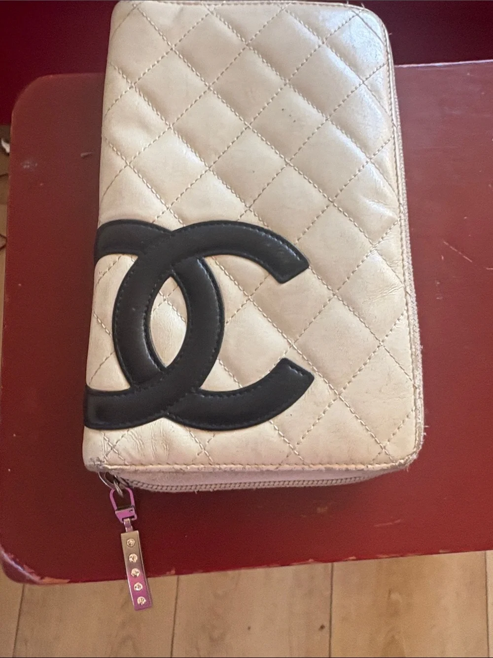 CHANEL Quilted Zip Wallet in Cream with Black CC